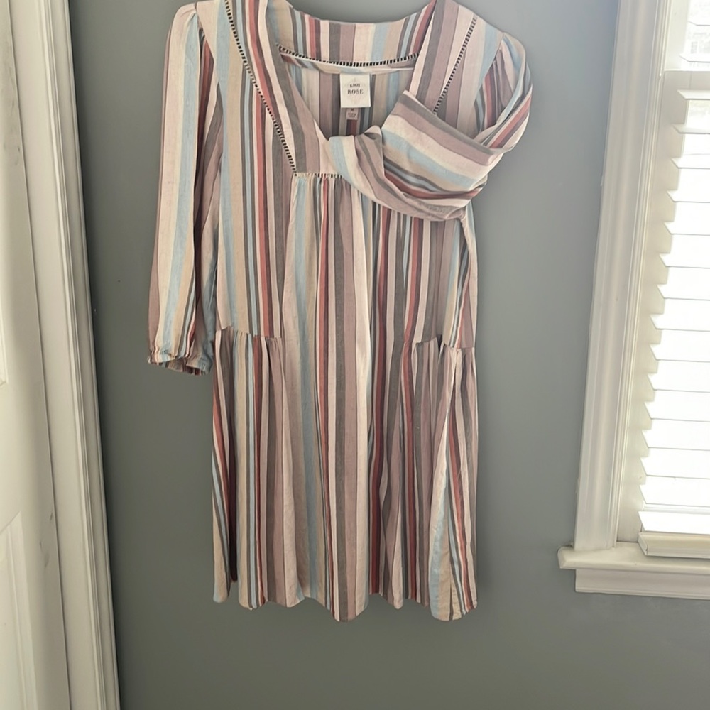 Light spring/summer neutral colors. Stretchy and soft dress.